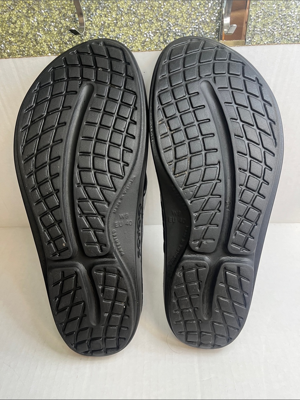 OOFOS Women's Black Flip Flop Sandals with Metallic Silver Straps - Picture 9 of 12